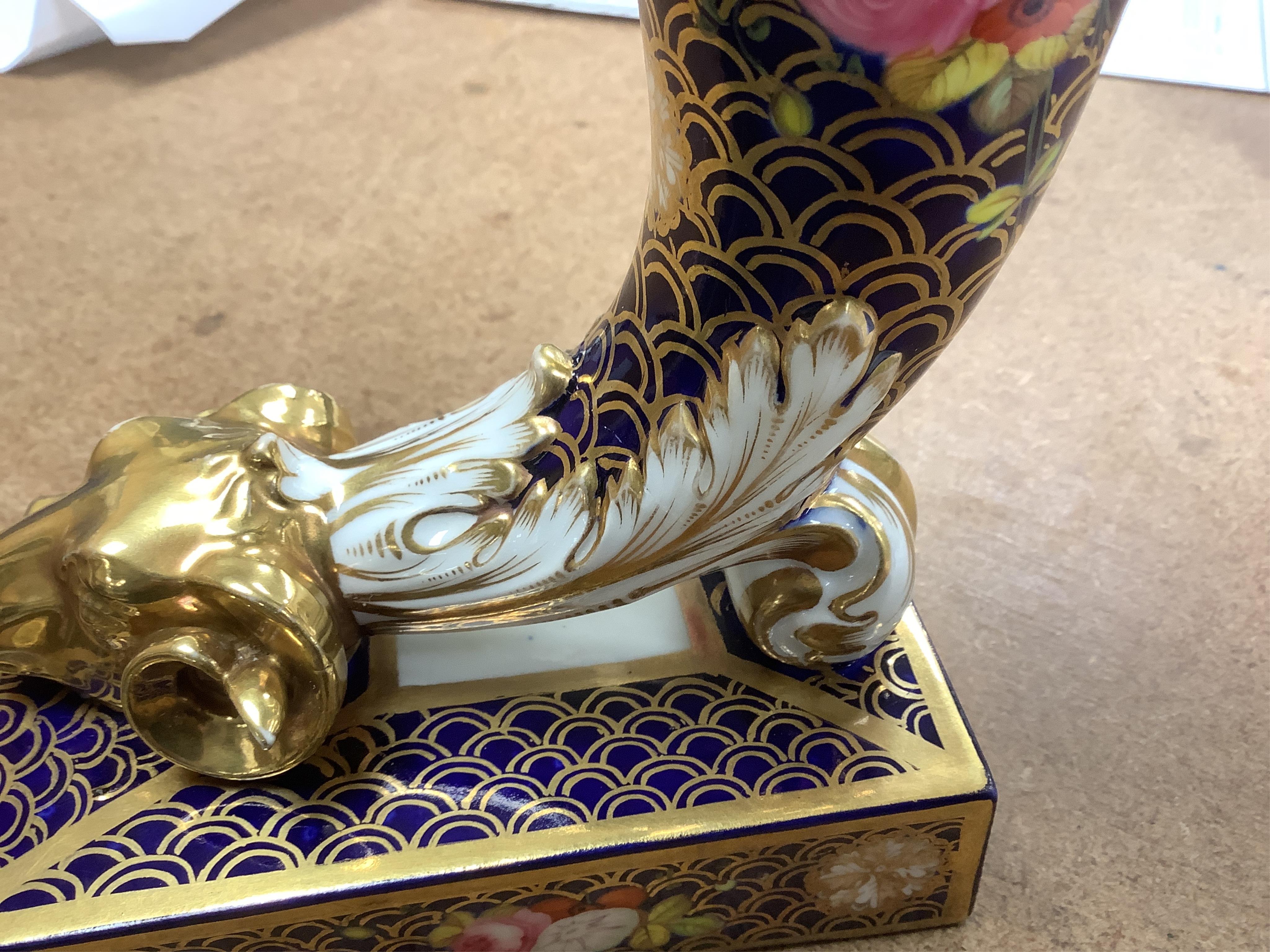A pair of Spode-type cornucopia vases, 18cm high (a.f.). Condition - restored
